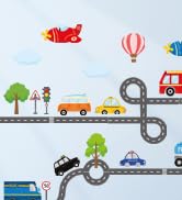 Simple cartoon illustration with vehicles, hot air balloons, and buildings on light blue background, featuring a road with various transportation elements.