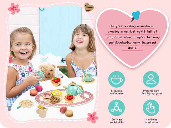 a little girl and a little girl sitting at a table with a toy tea party and a teapot.