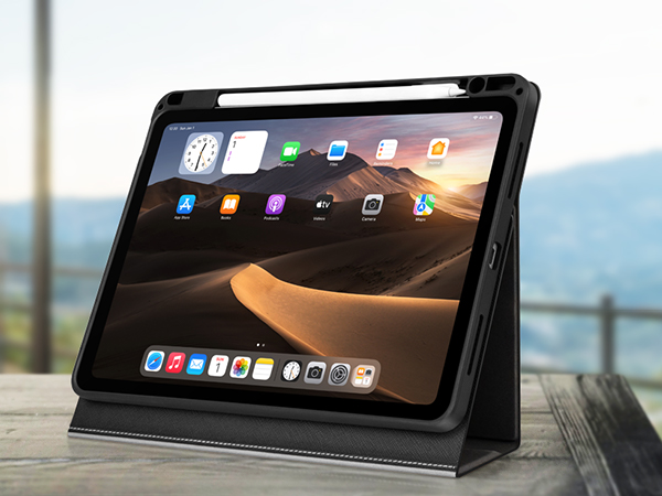 Black protective tablet case with stand functionality, displaying desert landscape wallpaper on screen with app icons visible.