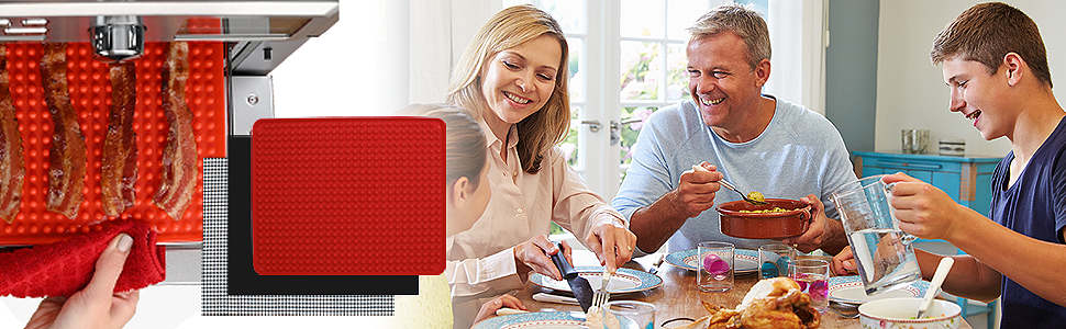 Family eating at dinner table using reusable mats for toaster ovens