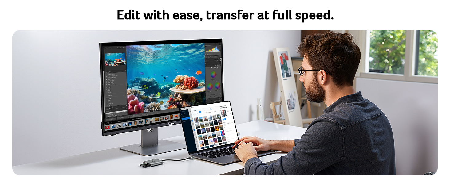 Person using laptop connected to large monitor displaying underwater scene. Text overlay: 'Edit with ease, transfer at full speed.' Demonstrates dual-screen photo editing setup.