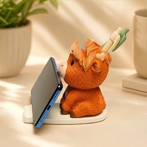 Highland cow phone stand holding smartphone vertically and horizontally