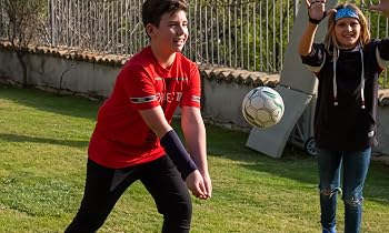 boy playing sport with arm weight