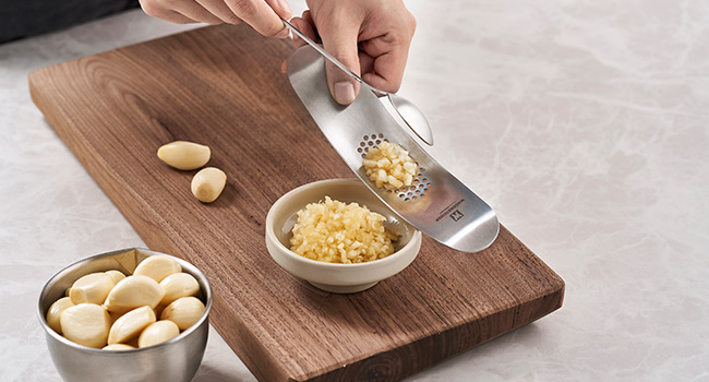 Grate, press, and scoop in one tool