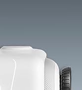 Close-up of a white device with curved edges and a visible black wheel or dial on its side against a gray background.