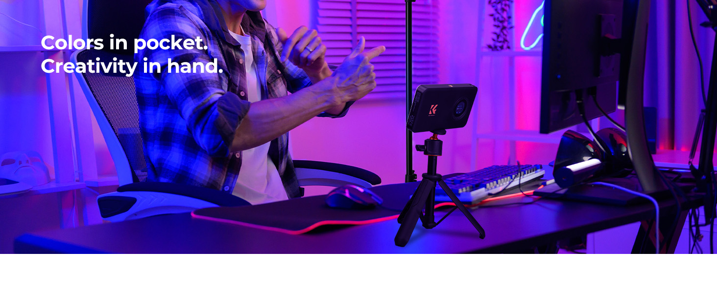 Text reads 'Colors in pocket' and 'Creativity in hand'. Purple and blue illuminated scene with electronic devices or displays.