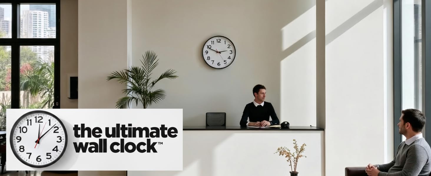 man sitting at a desk with clock