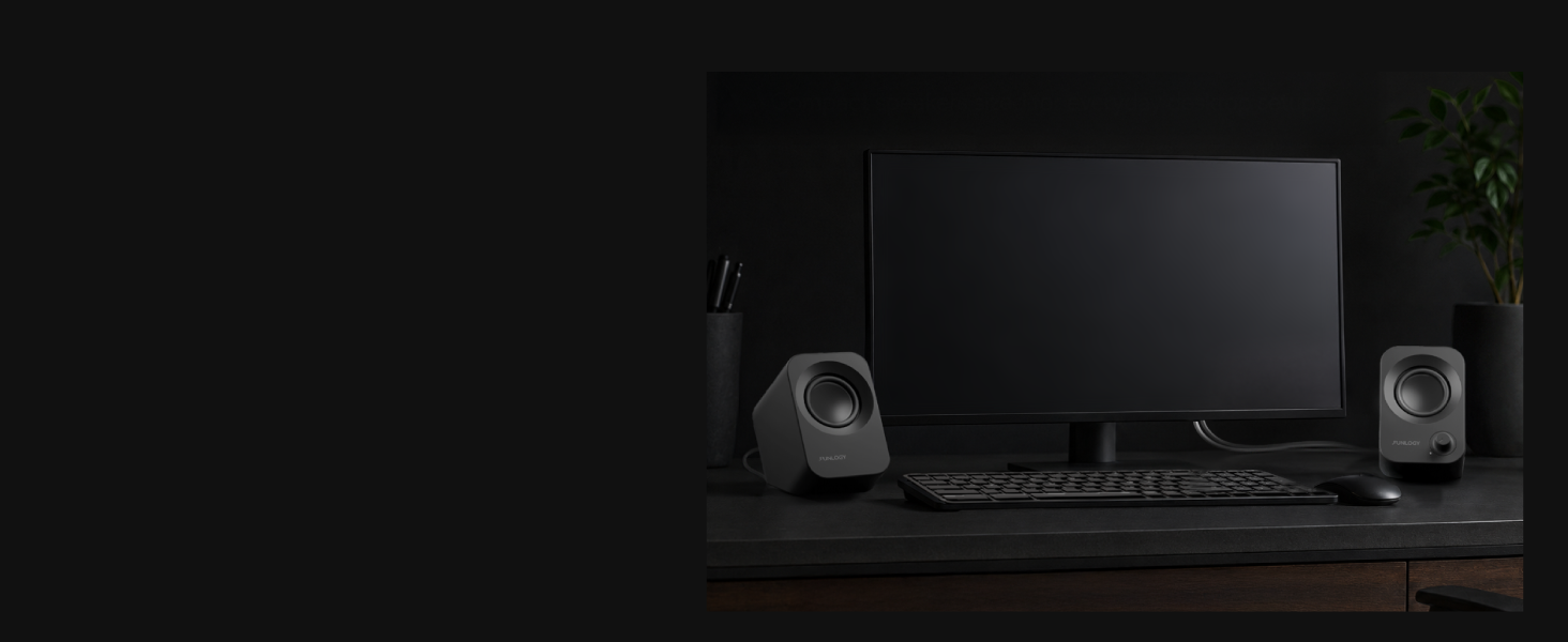 FUNLOGY Speaker Plus pair fitting beside a monitor, keyboard, and mouse.