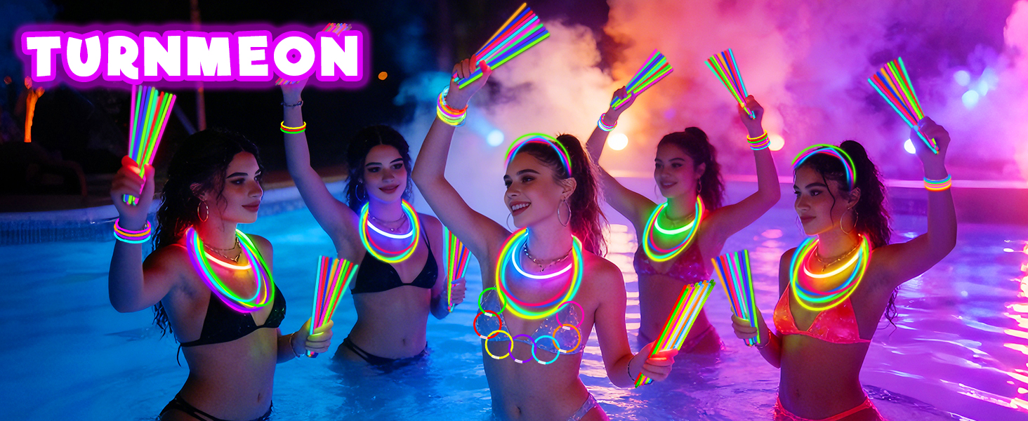 A group of people were having a party in the swimming pool using glow sticks.