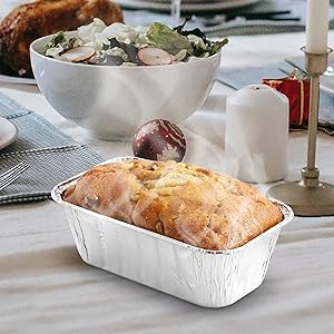 steaming hot bread in aluminum foil loaf tin pan