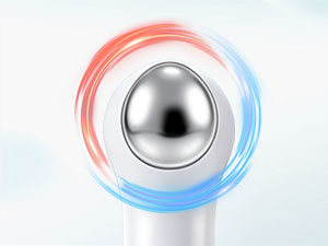 Close-up of a facial device with red and blue light rings swirling around its metallic head.