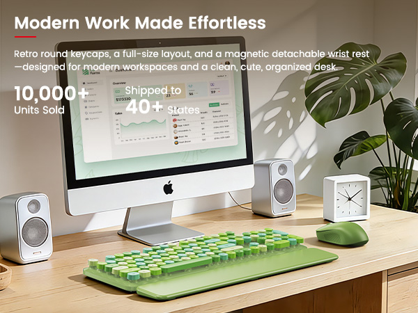 Green keyboard and mouse with wrist rest on a modern home office desk setup