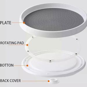 Exploded view of a circular device with labeled components: plate, rotating pad, bottom, and back cover. The plate has a perforated surface and white frame.