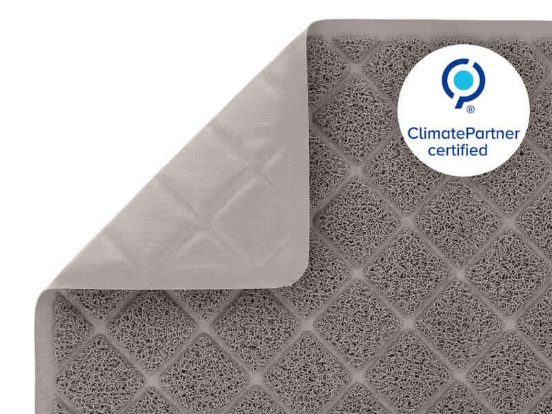 gray cat litter mat close up and folded over to show the litter mats slip resistant backing