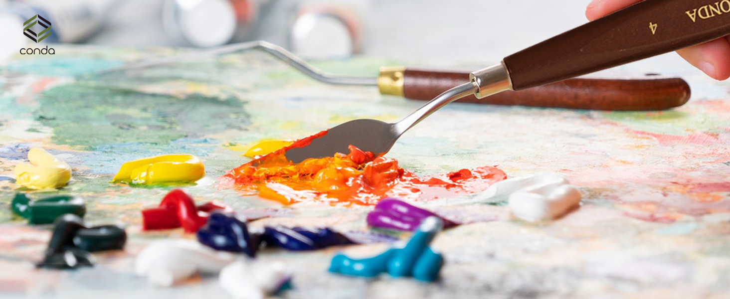 a paint brush and a paintbrush on a table.