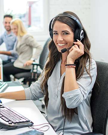 Customer service representative wearing headset in professional office environment, shown from multiple angles while working at computer desk.