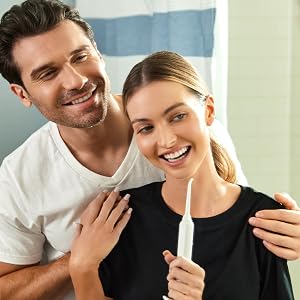 Man and woman using Aqua Flosser Pro