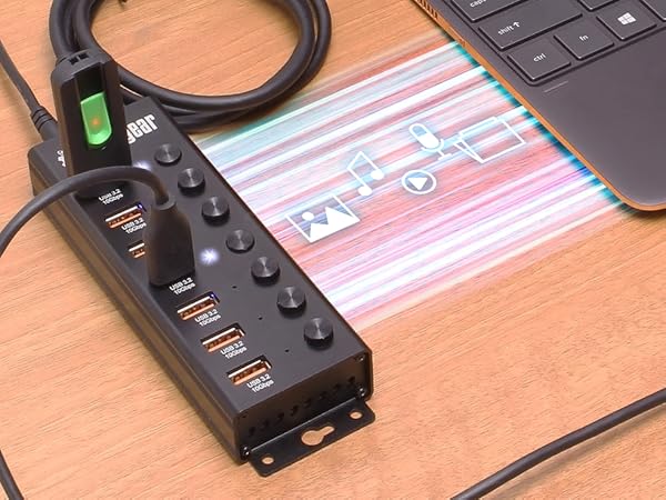 USB hub plugged into a laptop transferring files