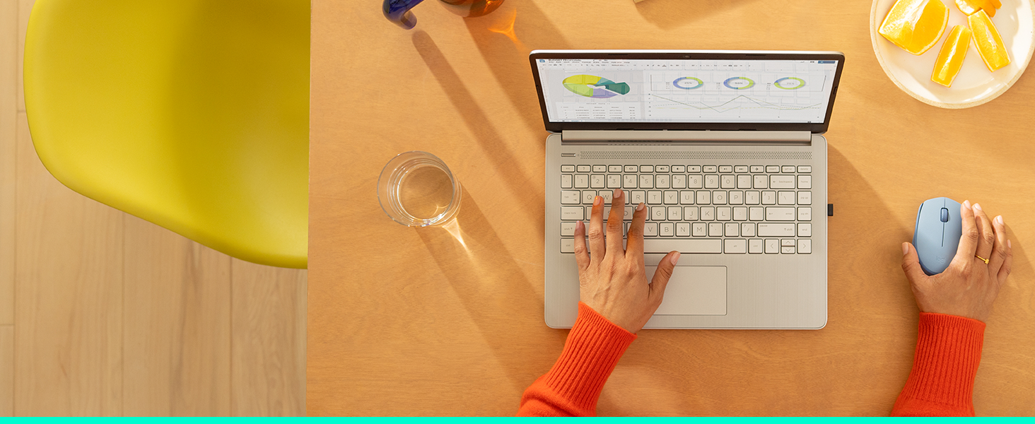 a woman working on a laptop using m170 wireless blue gray mouse