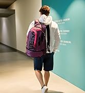man with a pink arena Fastpack bag on his shoulder in the gym locker room great for swim practice