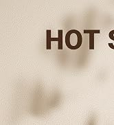 Brown text reading 'HOT S' on a textured beige wall surface.