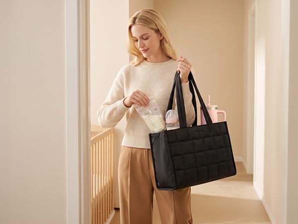 Spacious tote holds baby bottles, diapers and mom essentials as a stylish diaper bag alternative