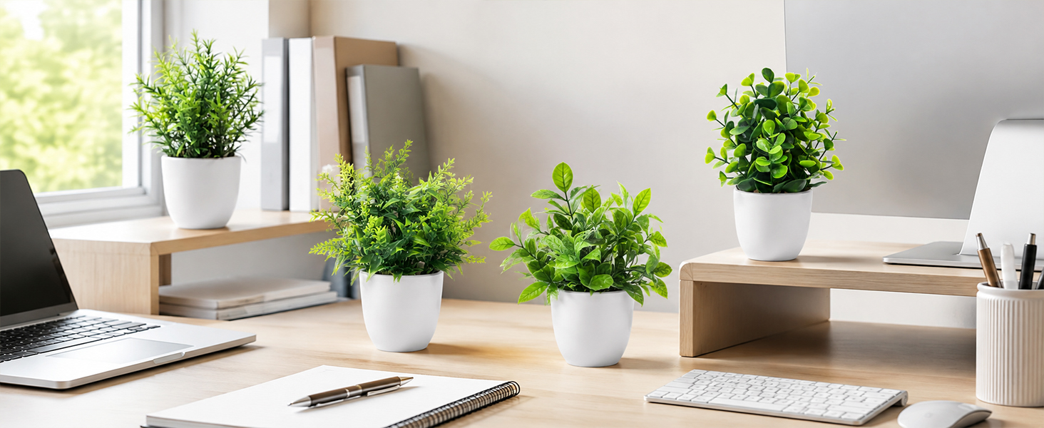 four artificial green plants white pots office desk decor