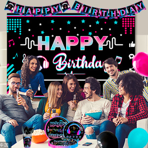 Birthday party decoration featuring 'HAPPY BIRTHDAY' text in bright pink and blue neon-style design with polka dot pattern.