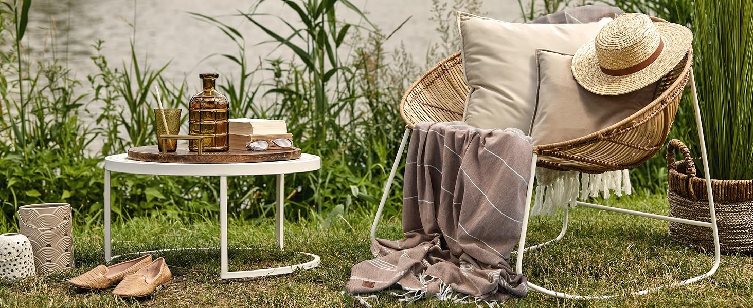 brown gold case turkish towel on a chair at the garden