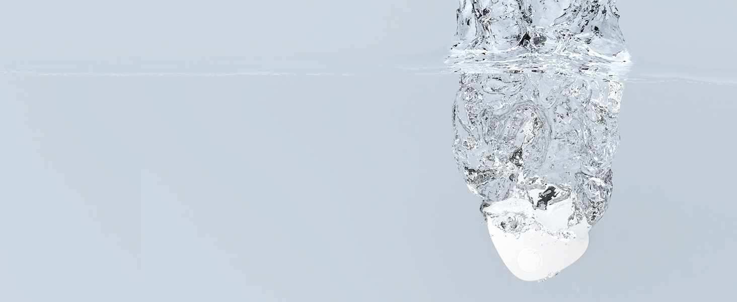 White spherical object with water droplets and crystalline texture on pale background.