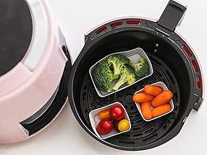 Square and rectangle silicone baking cups in an air fryer with vegetables