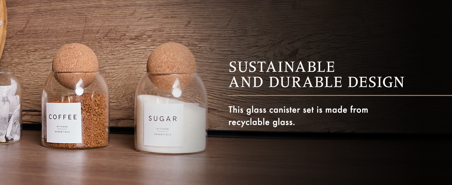 Two glass jars with cork lids labeled 'Coffee' and 'Sugar' on wooden surface. Text highlights sustainable design and use of recyclable glass.