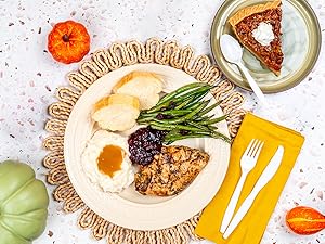 A thanksgiving dinner plate with cutlery on side.