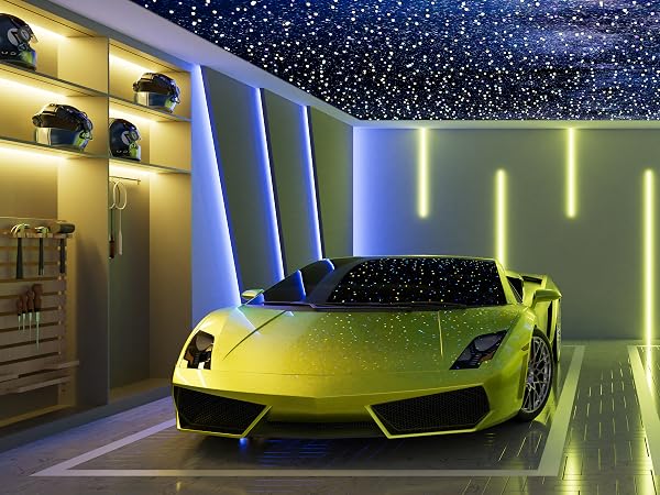 Yellow sports car parked in illuminated garage with starry ceiling. Sleek design with angular body, low profile, and visible headlights. Garage features built-in storage and colorful lighting accents.