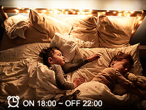 Two people sleeping under warm blankets with a digital clock overlay showing 'ON 18:00 - OFF 22:00'.