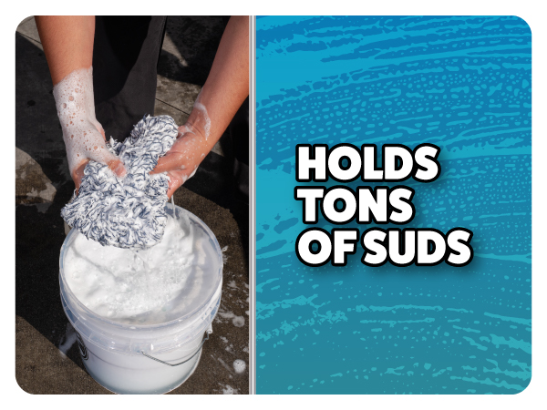 Car wash mitt rinsed in bucket filled with foam soap showing high sud retention for cleaning