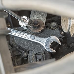 Pick up tool picking up a wrench in car