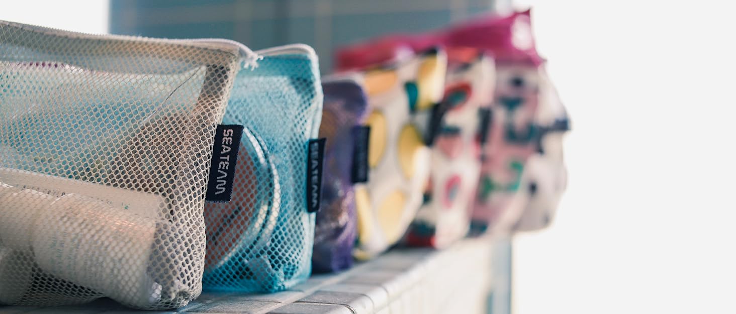 7 cosmetic bags on a sill