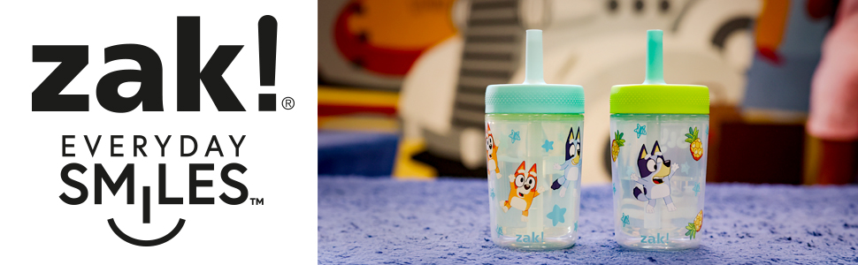 Two plastic Bluey kids tumblers with silicone straws on blue carpet, with zak! everyday smiles logo