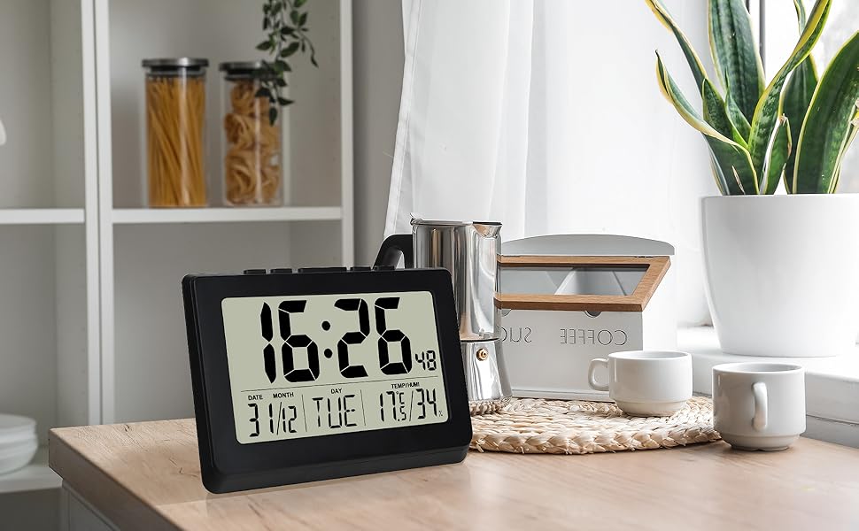 black digital alarm clock desk