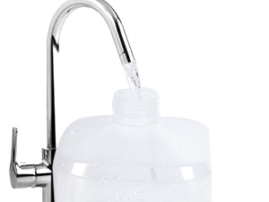 Close-up of a chrome kitchen faucet with a white plastic water filter attachment connected to the spout, demonstrating a home water filtration system.
