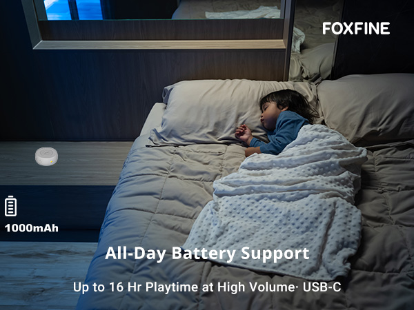 Sleeping child with sound machine on bedside table, indicating long battery life for overnight use