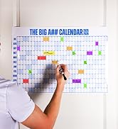 man writing on calendar