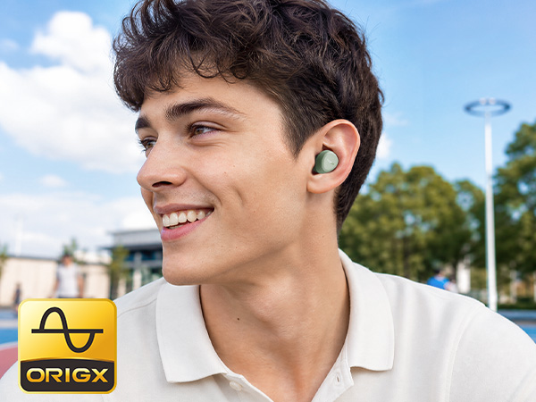 Person wearing TOZO A1 earbuds in everyday outdoor setting with OrigX tuned sound