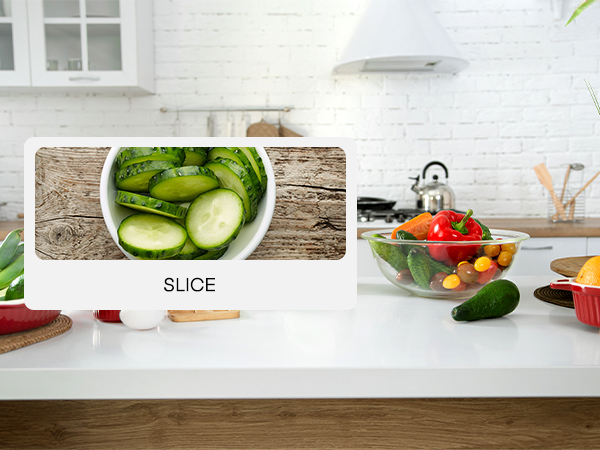 a photo of a kitchen counter with a slice of cucumber on it.