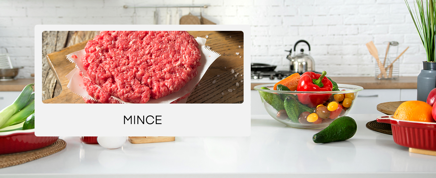 a picture of a hamburger on a cutting board with vegetables in the background.