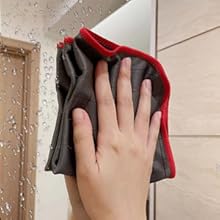 a person cleaning their hands with a towel