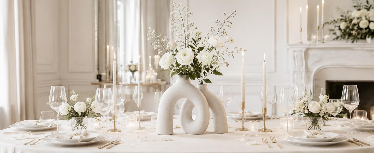 Cream ceramic donut vase with white flowers on an elegant wedding table