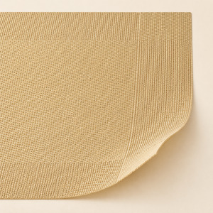 Close-up of champagne gold woven placemat texture and flexible edge