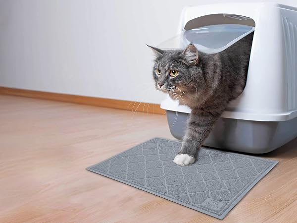 Cat stepping onto the Neater Mat Litter Trapping Mat in Grey
